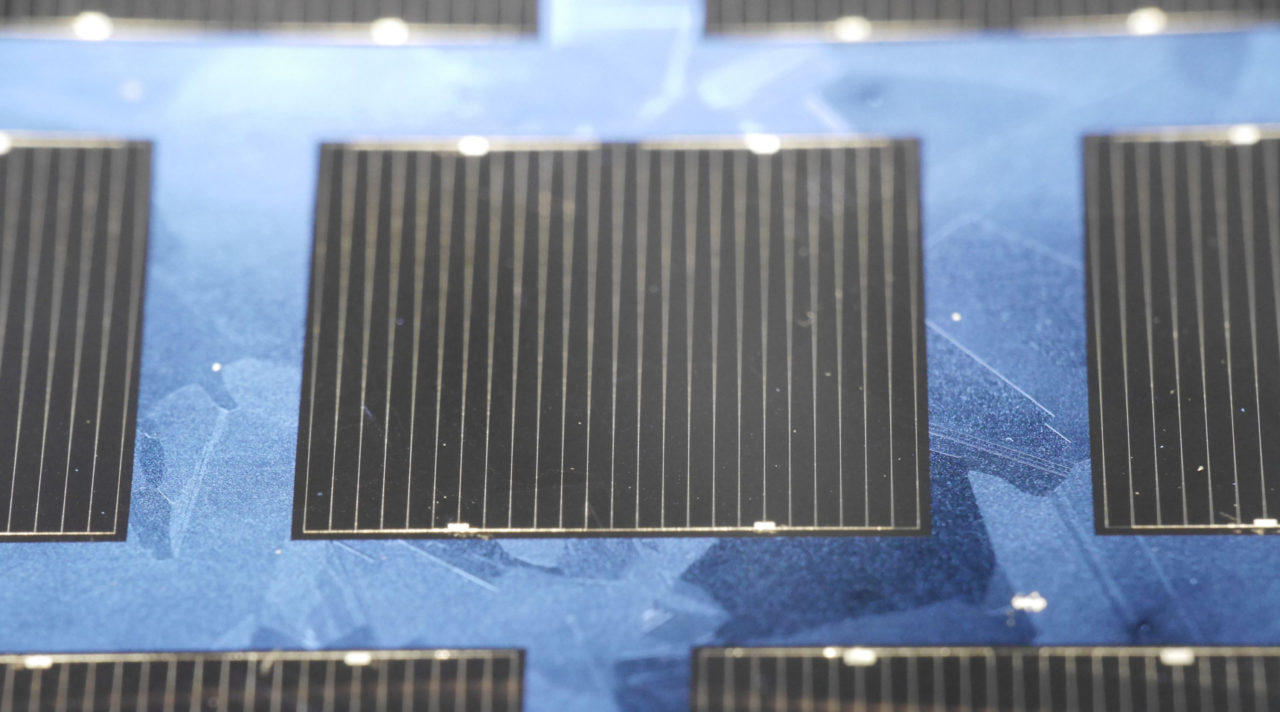 The multicrystalline world record solar cell made of n-type HPM silicon with an area of 2 cm x 2 cm. The cell has excellent antireflection properties; therefore the cell appears almost black with almost no detectable grain boundaries. Image: Fraunhofer ISE.
