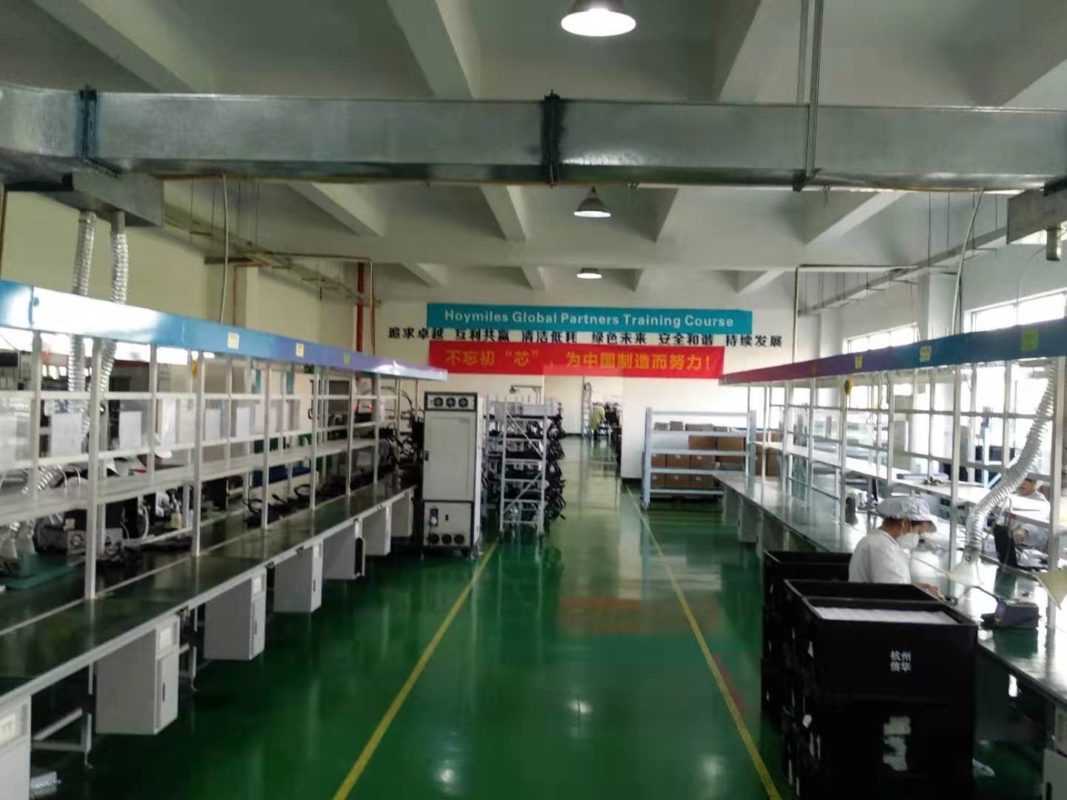 Among the products hitting factory shelves when PV Tech visited were MI-1200 units, marketed as the world's first single-phase microinverter able to service four panels at once (Image credit: Solar Media)