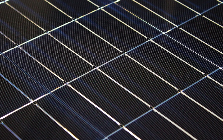 Close-up of the photovoltaic module with an efficiency of 20.2% developed at the Institute for Solar Energy Research Hamelin. The bright stripes between and on top of the cells arise from the light reflection by the highly reflective cell interconnectors and the space between the solar cells.