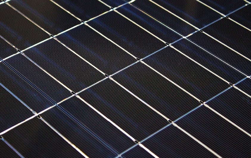 Close-up of the photovoltaic module with an efficiency of 20.2% developed at the Institute for Solar Energy Research Hamelin. The bright stripes between and on top of the cells arise from the light reflection by the highly reflective cell interconnectors and the space between the solar cells.