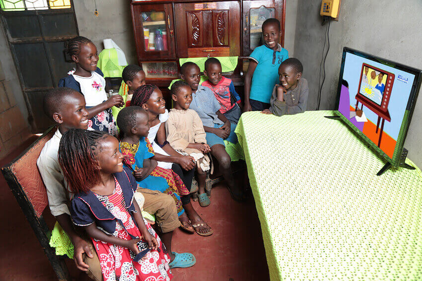 Off-grid solar could help keep lights on for children provided with up to eight hours of daily lessons through TV and radio. Image credit: Azuri Technologies