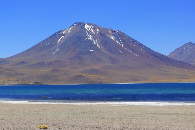 A volcano and lake near the San Pedro de Atacama in the Antofagasta region of Chile. Source: Flickr / Person with no name