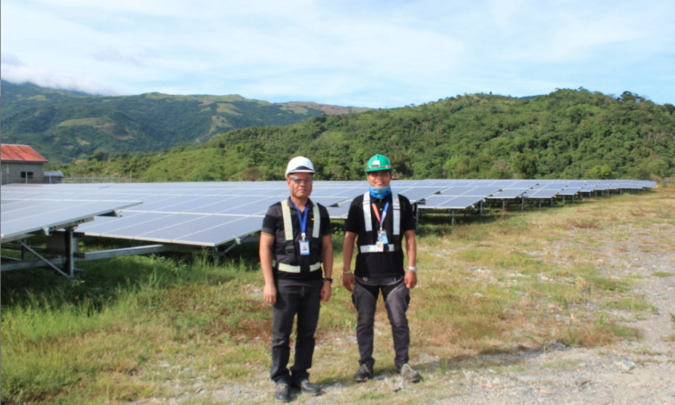 O&M operators at Solar Philippines' solar-battery micro-grid in Palaun, Mindoro, using Tesla batteries, PV and diesel to supply 24/7 power in a remote, rural region.