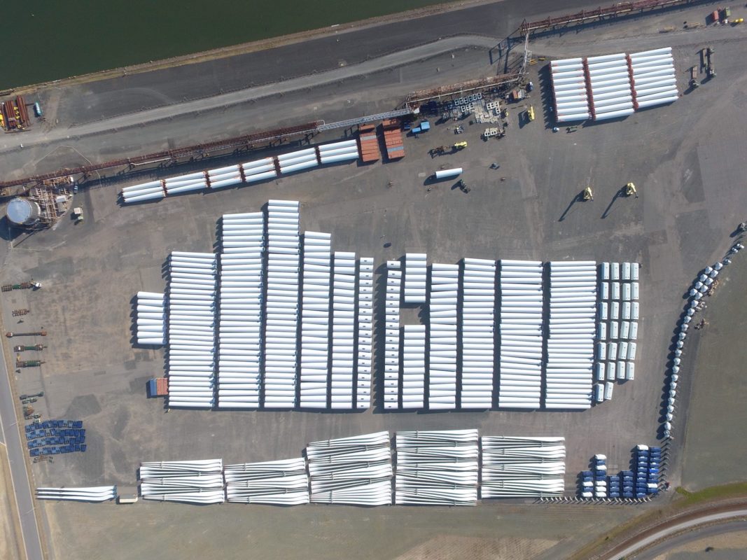 Equipment including blades, rotors and towers to be used at Sapphire Wind Farm awaiting transportation to the site. Image: CWP via Twitter.