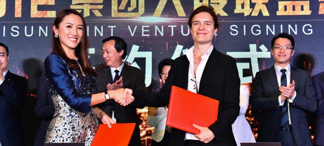 Yesterday in Shanghai, Engie China's COO Charlotte Roule (right) signed the agreement for a 30% equity investment with Unisun Energy Group's president He Yisha (left). Source: Engie