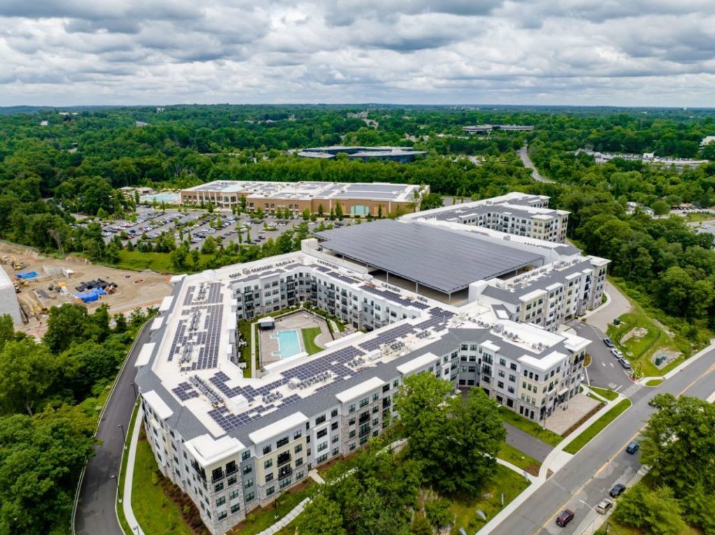 Building complex in the US state of New York with solar panels installed atop of it