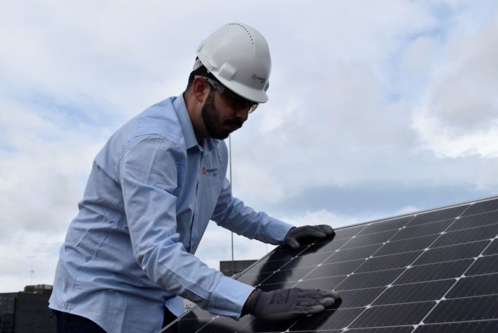 Enertis Applus+ technician working on a solar panel