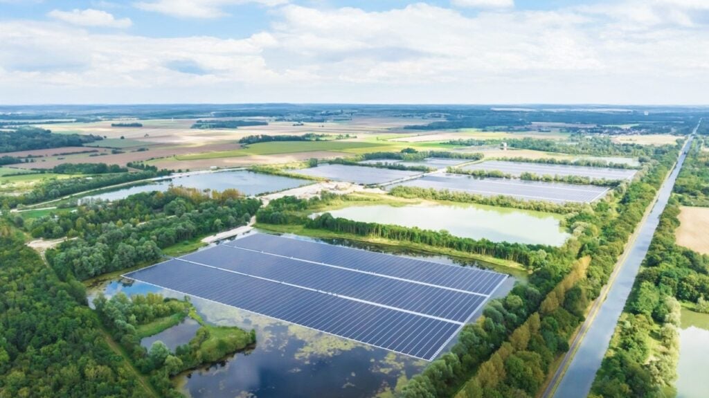 The Les Ilots Blandin solar plant spans 127 hectares and features over 135,000 photovoltaic modules, delivering an installed capacity of 74.3MWp. Image: Q Energy via LinkedIn.