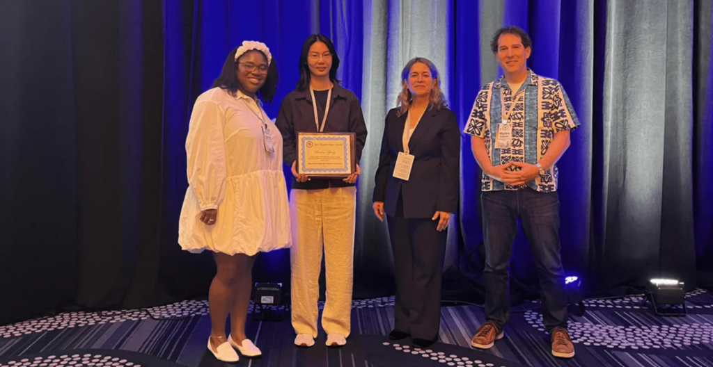 Ruohan Zhong receives an award from the IEEE.
