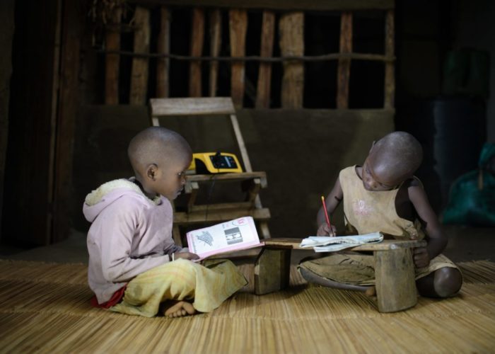 Children_studying_at_night_under_light_from_the_ReadyPay_Power_System