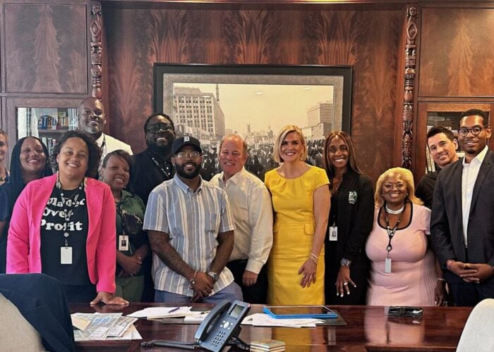 Mayor Duggan (center) joined by project stakeholders after approving the contract. Image: Lightstar.
