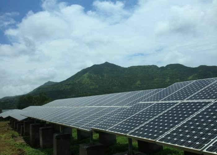 Tata_solar_installation_with_mountain_India-768x512