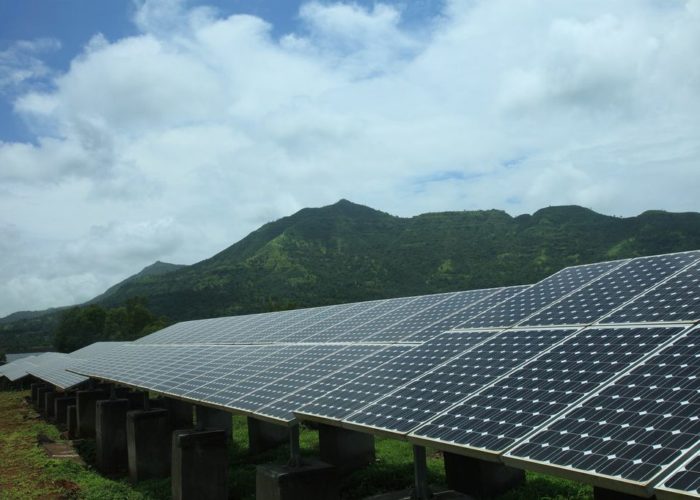 Tata_solar_installation_with_mountain_India