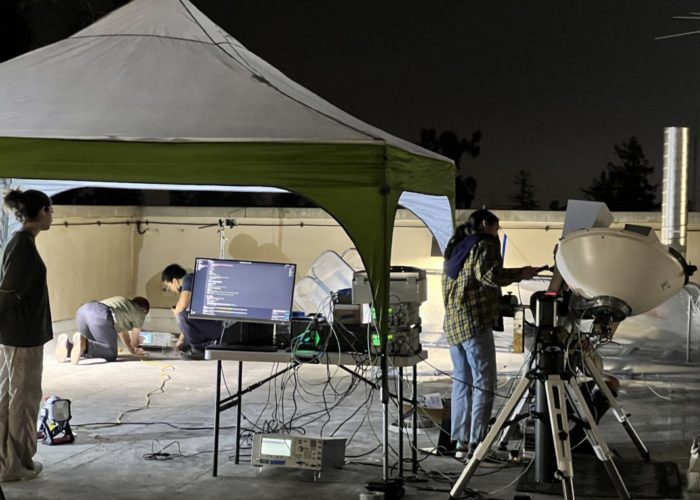 Caltech researchers working on the MAPLE experiment. Credit: Ali Hajimiri