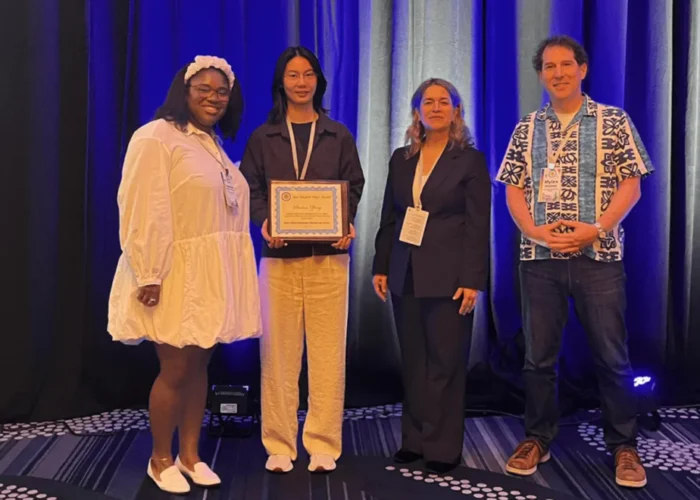 Ruohan Zhong receives an award from the IEEE.