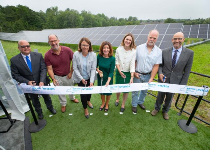 July 13, 2021 - Bethel, NY-- Lt. Governor Kathy Hochul cuts the ribbon at the Generate Capital Community Solar Project, along with NYSERDA President and CEO Doreen Harris.  (Philip Kamrass/ New York Power Authority)