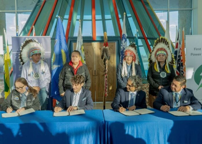 A signing ceremony including Neoen and SaskPower.
